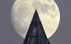 December's nearly full moon, known as the Cold Moon, rises over One PPG Place Downtown Pittsburgh, Friday, Dec. 1, 2017. It's a perigee moon, the clos