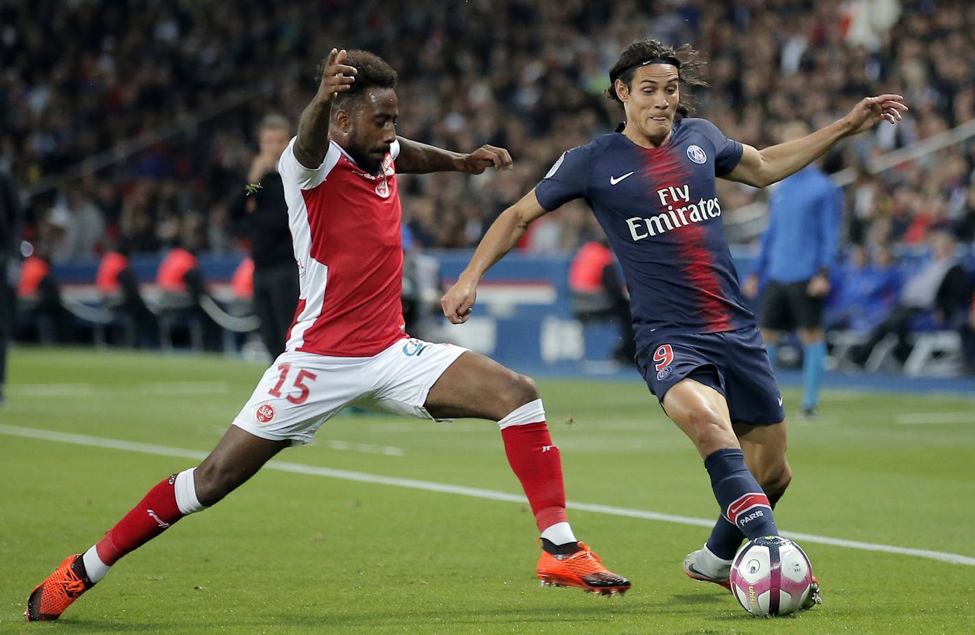 Newly acquired Minnesota United defender Romain Metanire (left), playing for Reims during a French League One soccer match against Paris-Saint-Germain on Sept. 26 in Paris,