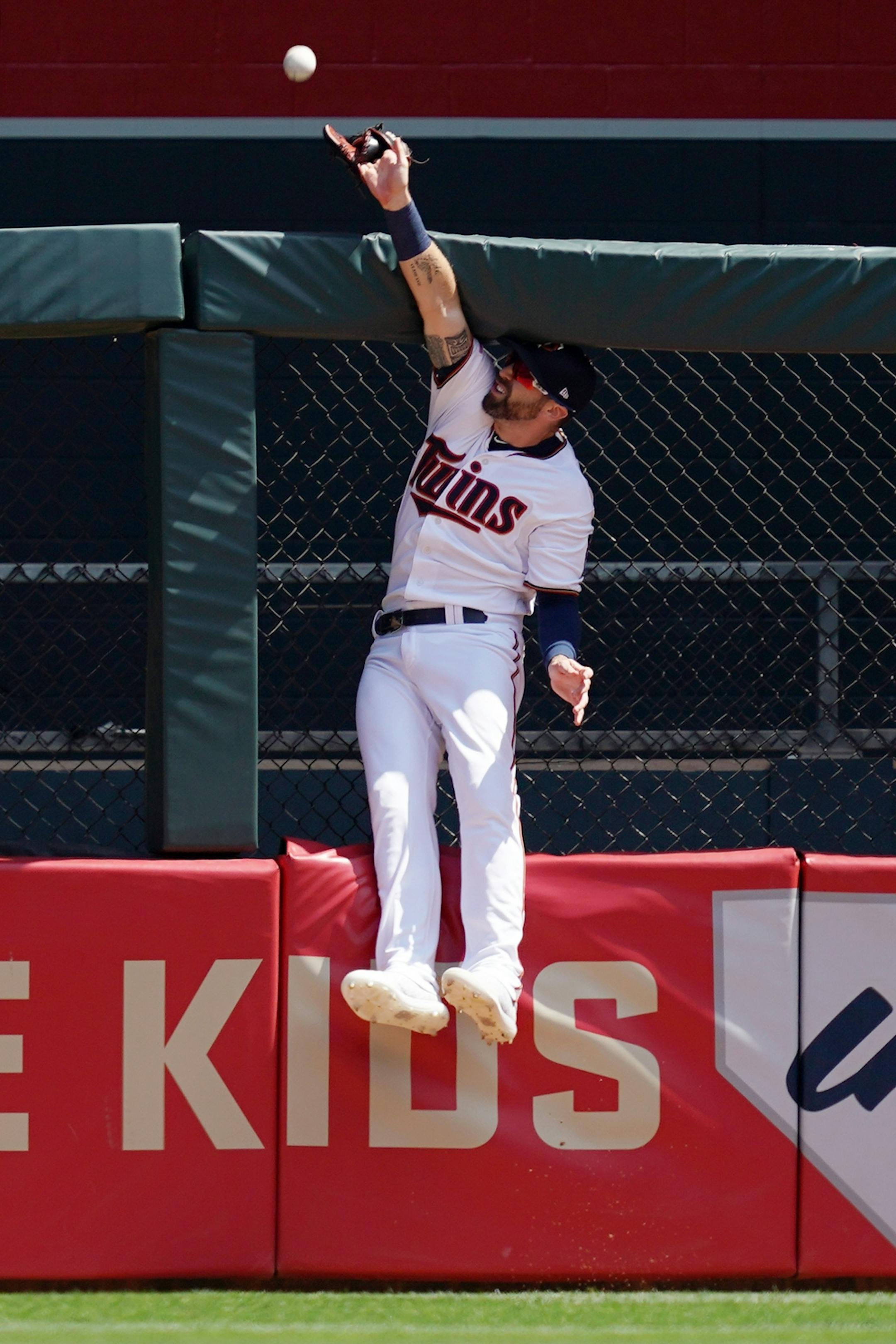 Minnesota Twins center fielder Jake Cave (60) leapt but was unable to field a solo home run hit by Atlanta Braves first baseman Freddie Freeman (5) in the first inning.