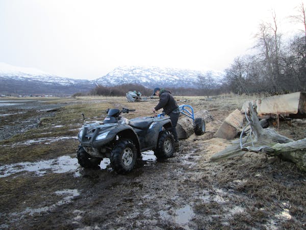 Builder Nick Blanco attached a log to his ATV in Larsen Bay, Alaska, as seen on DIY Network's "Building Alaska."