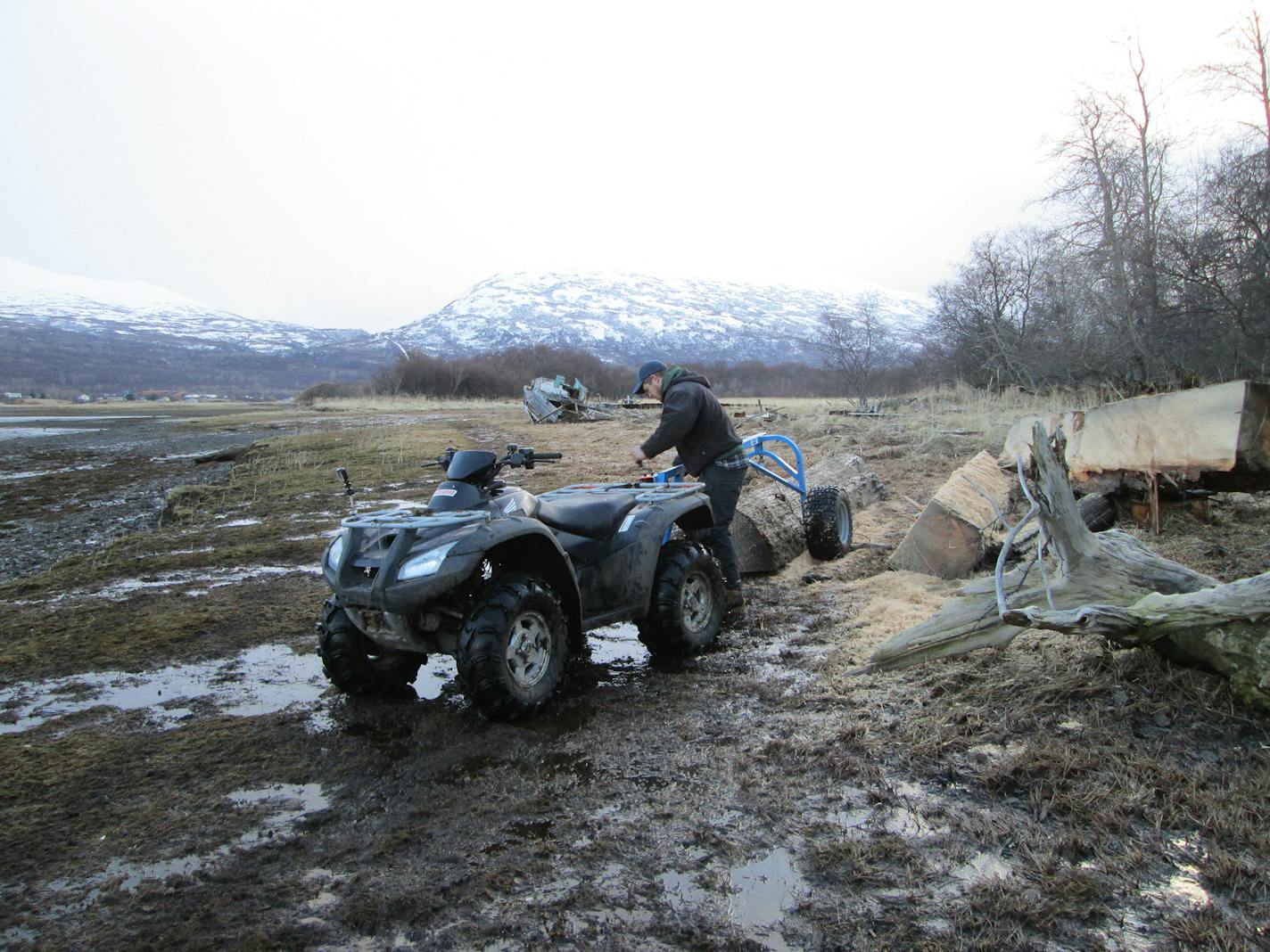 Builder Nick Blanco attached a log to his ATV in Larsen Bay, Alaska, as seen on DIY Network's "Building Alaska."