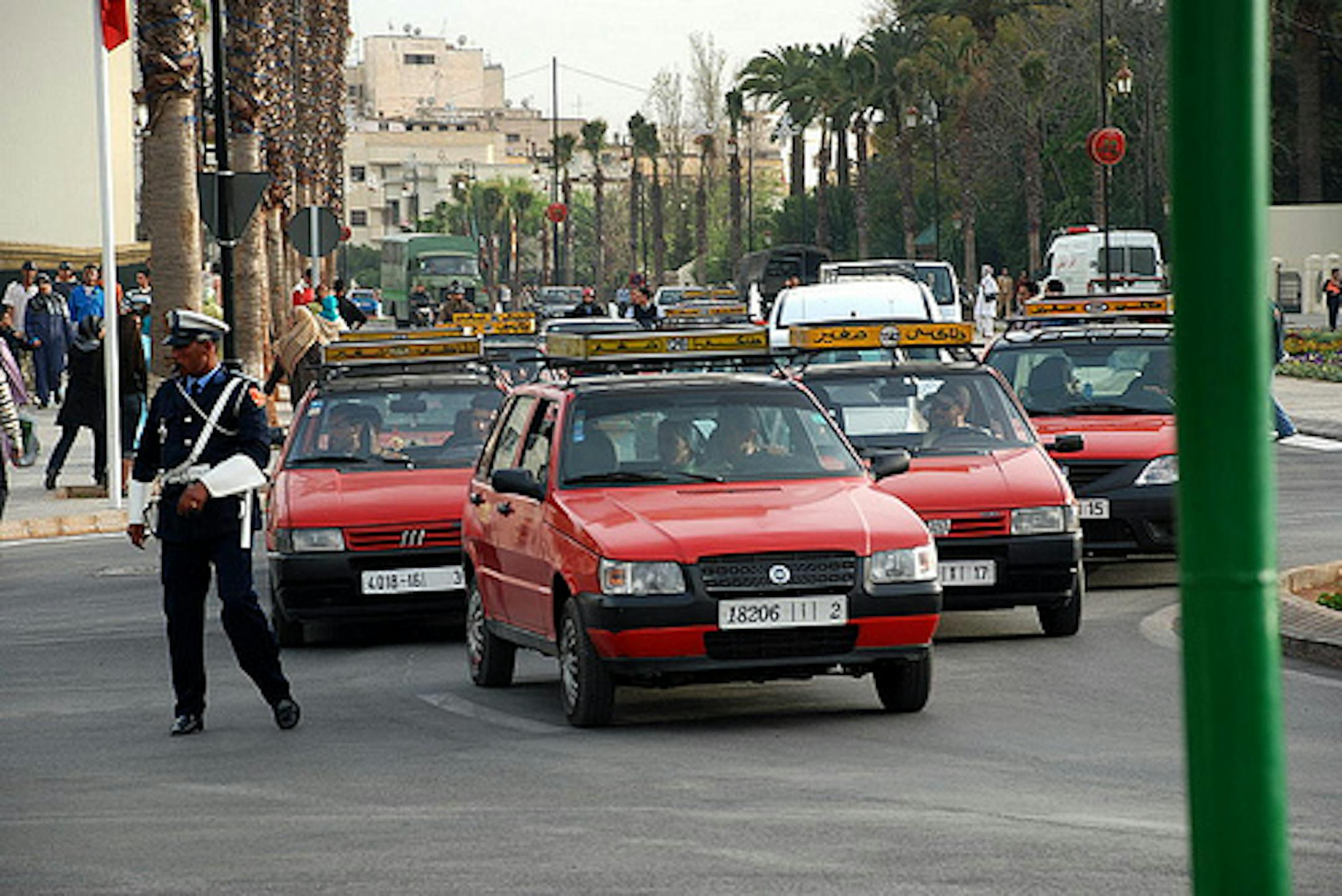 A fleet of Moroccan taxis, none of which will give you a ride.