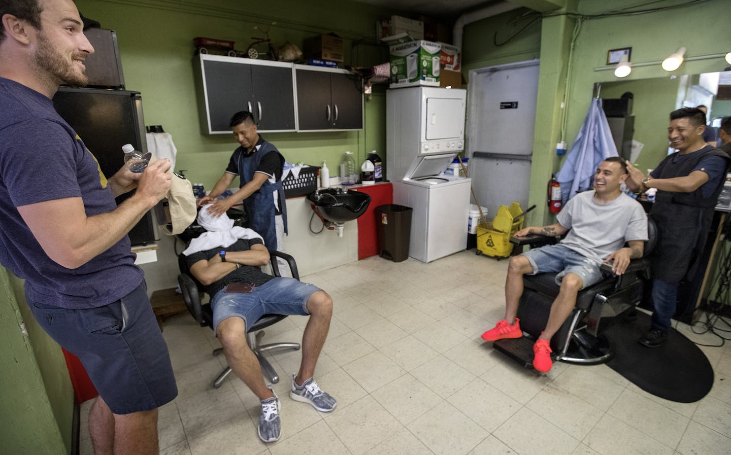 Brent Kallman, Christian Ramirez and Miguel Ibarra joked at J&C Champions in Minneapolis. The Minnesota United teammates get their haircut at the same location before games. ] CARLOS GONZALEZ &#xef; cgonzalez@startribune.com - June 1, 2017, Minneapolis, MN, Minnesota United Loons, Haircuts, J&C Champions Salon and Barber, four or five players will be getting hair cuts. Among them: Christian Ramirez, Miguel Ibarra, Bashkim Kadrii, Abu Danladi, Brent Kallman