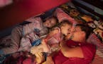Jeanette Chafee snuggled and read a book with her daughters Madison, 8, and Ally, 3, at home in Scandia, Minn., on Wednesday, September 18, 2019. Bedt