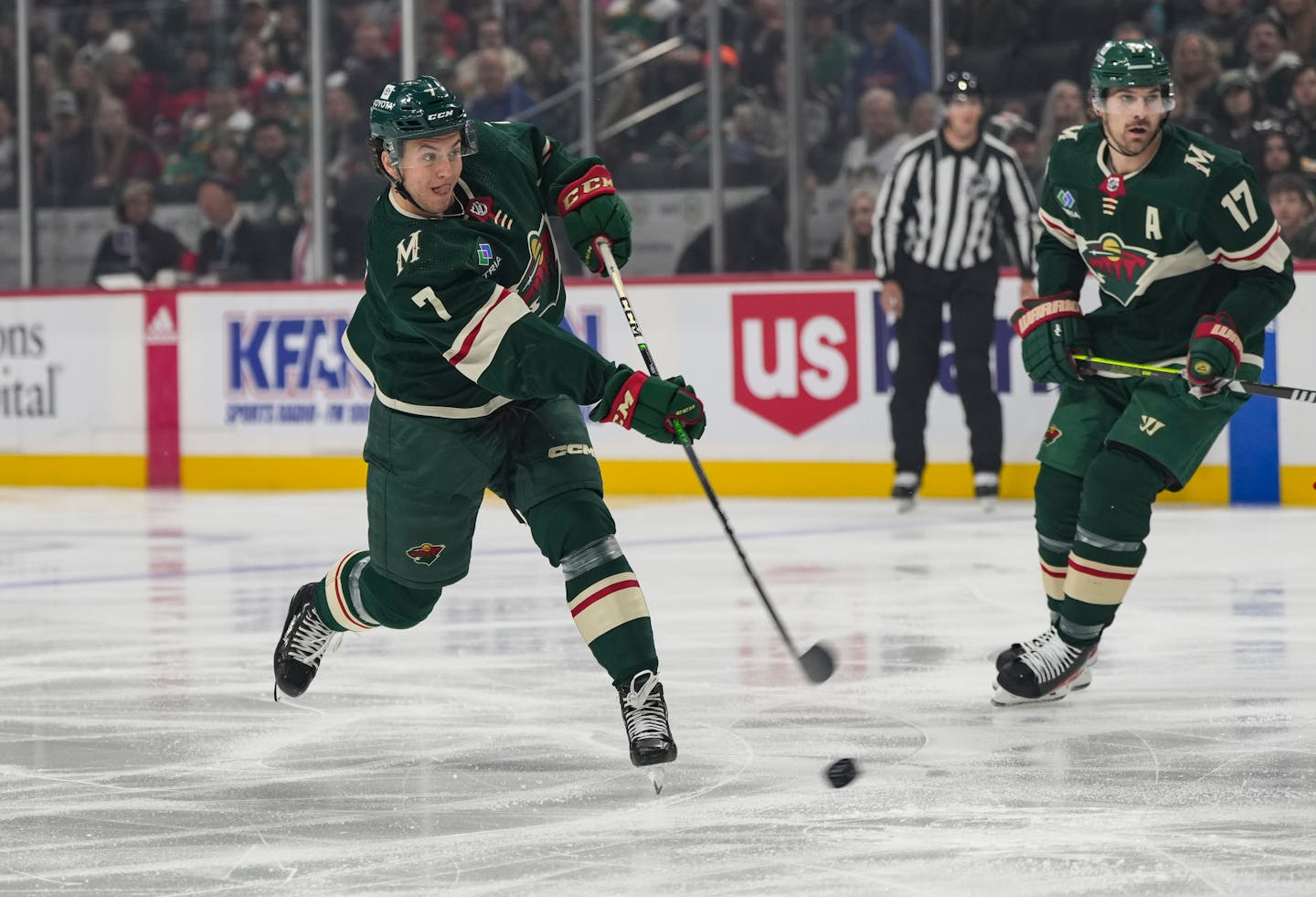 Minnesota Wild defenseman Brock Faber (7) takes a shot on goal in the first period.