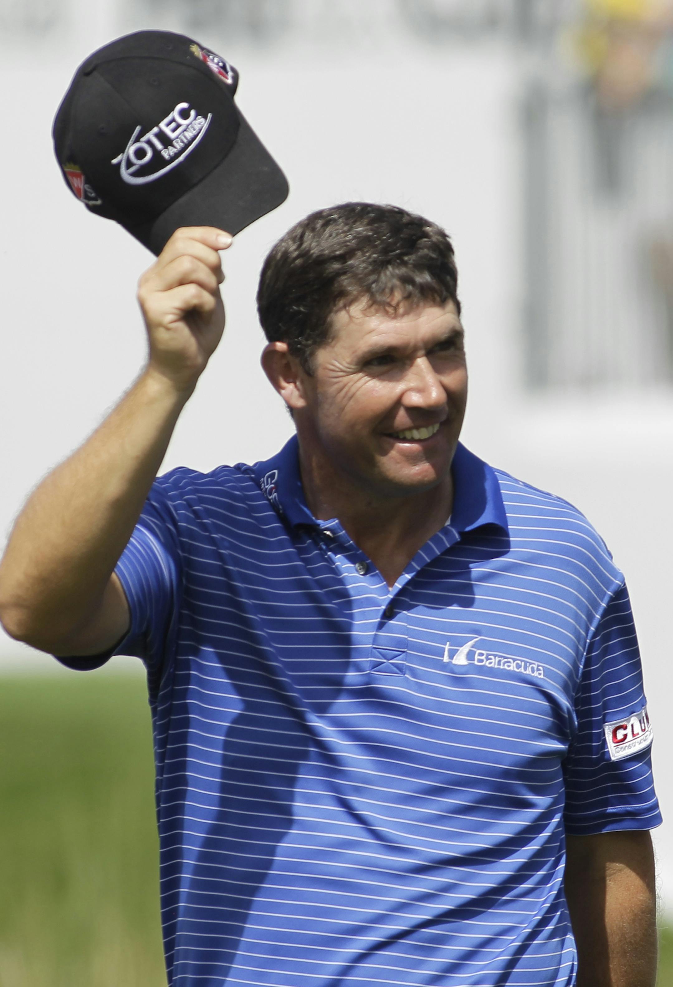 Padraig Harrington acknowledges the crowd as he approaches the 17th green during a two hole playoff against Daniel Berger at the Honda Classic golf tournament, Monday, March 2, 2015, in Palm Beach Gardens, Fla. (AP Photo/Luis M. Alvarez)