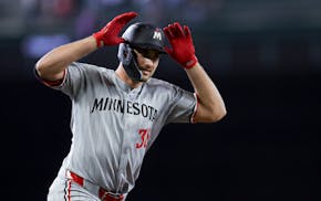 Twins right fielder Matt Wallner celebrates while running the bases after hitting a two-run homer during the second inning of Saturday night's game at