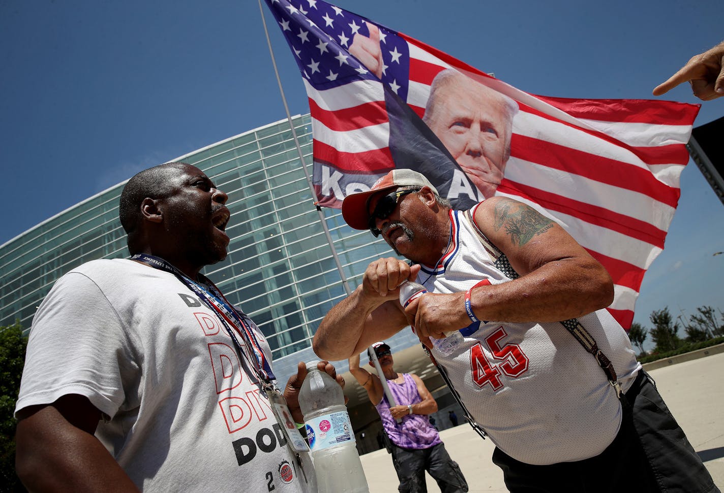 Nicholas Winford, left, debated Randal Thom on the racial policies of President Donald Trump outside the BOK Center in Tulsa, where Trump was holding a rally, on June 18, 2020.