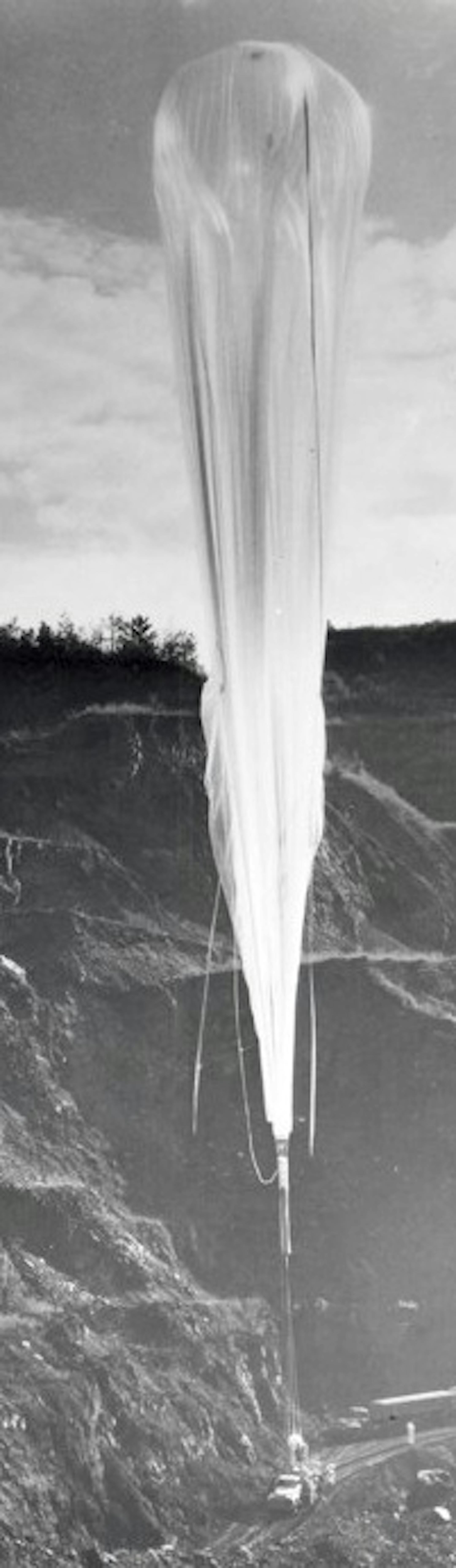 8. On 20 August 1957, Air Force scientist Major David G. Simons set a new record for balloonists of approximately 102,000 feet. Here, Winzen launch crew wait for vertical alignment of the balloon above the gondola just prior to launching at Crosby, Minnesota.