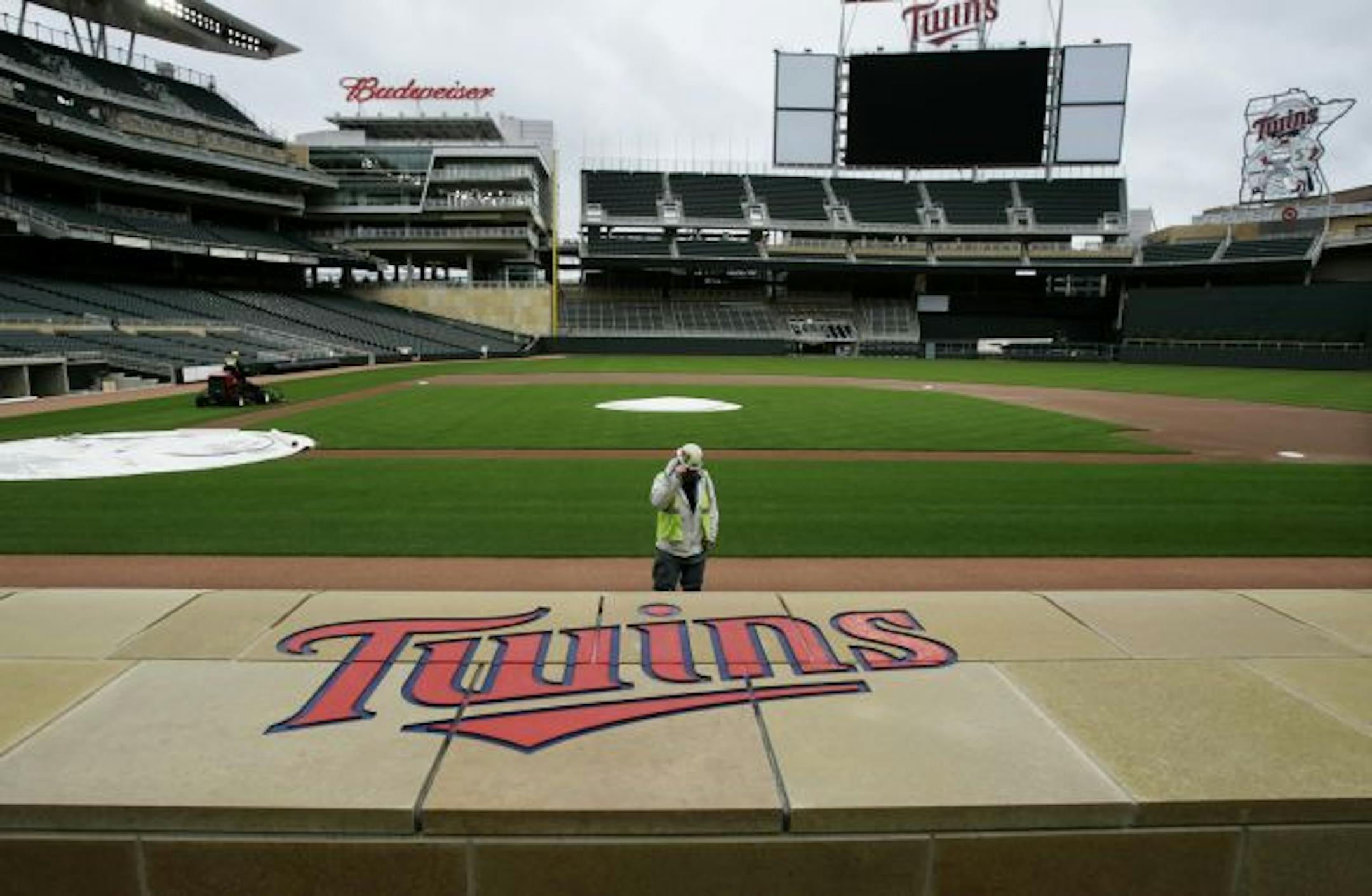 As improvements go on outside the stadium, the Twins team has spent at least $55 million more than originally planned on ballpark amenities, including radiant heating in the stands and the giant left field scoreboard.