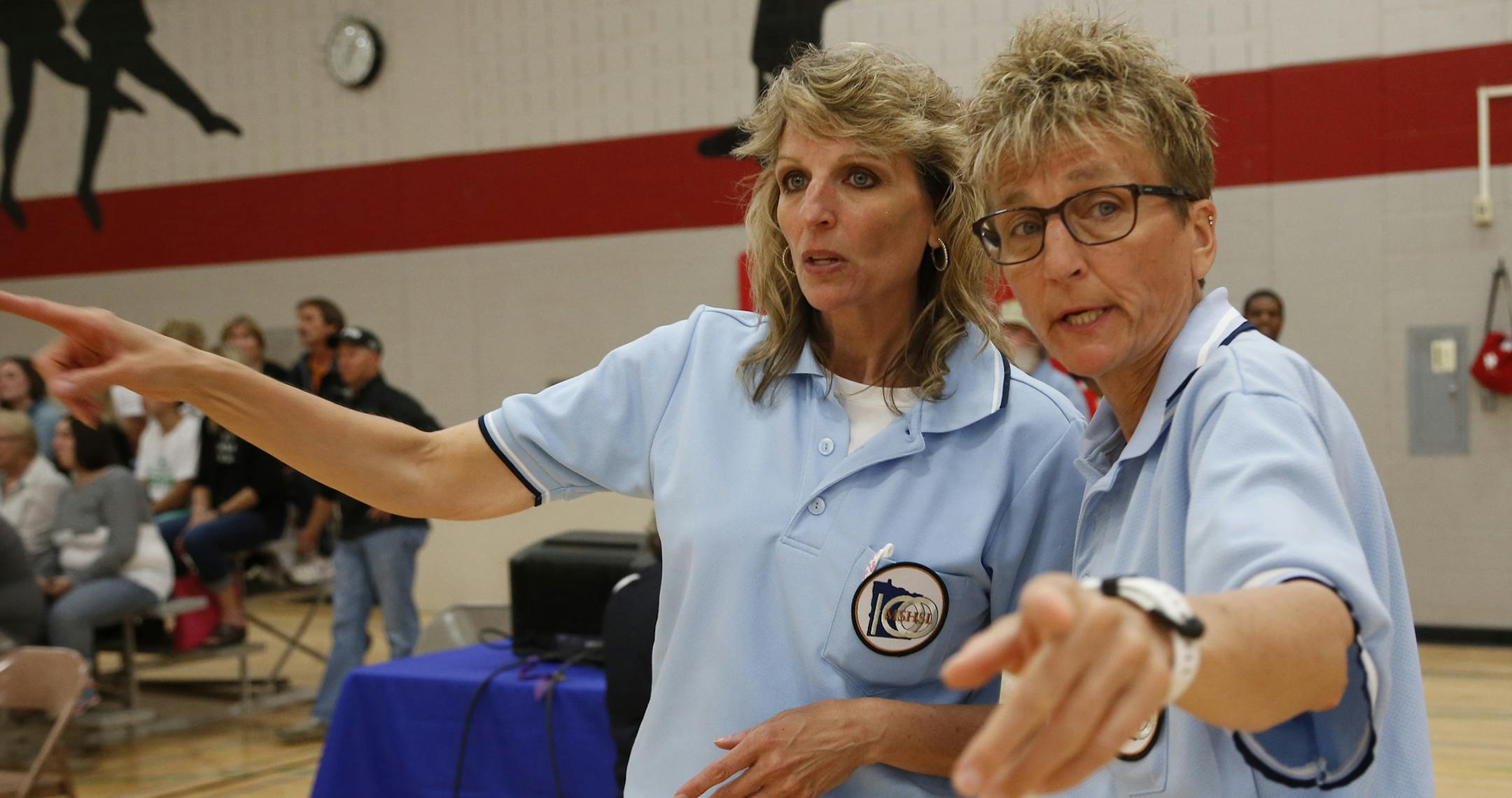 Sisters Michelle Schneider, left, and Jacki Wincek are longtime officials who enjoy working adapted tournaments.