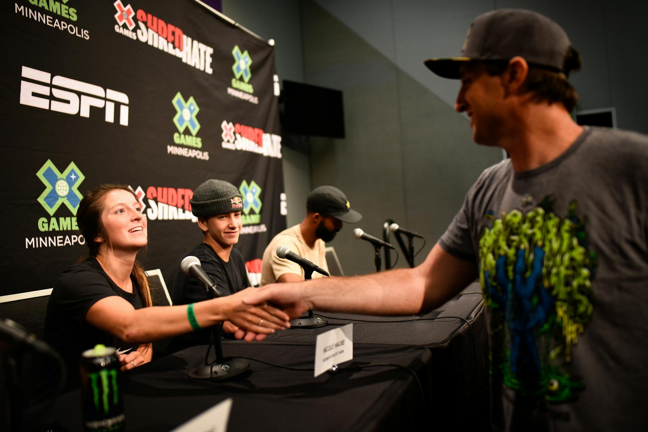 Nicole Hause, of Stillwater, shook hands with Tim Reed, X Games vice president, at the conclusion of Wednesday's panel at US Bank Stadium.