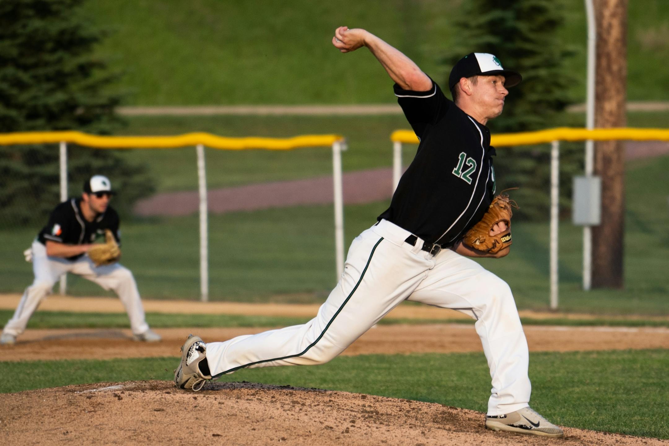 Tyler Peterson pitches for the Irish during a game against Bird Island at Irish Yard.