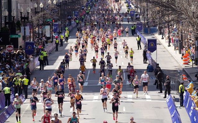 Runners approach the finish line Monday at the Boston Marathon.