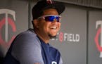 Minnesota Twins Adalberto Mejia smiles in the dugout during a baseball game with the Kansas City Royals Sunday, Aug. 5, 2018, in Minneapolis. (AP Phot