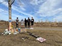 Friends of the victim involved in a fatal crash in Woodbury on gathered Sunday, March 14, 2021, at the scene of the crash where people brought flowers