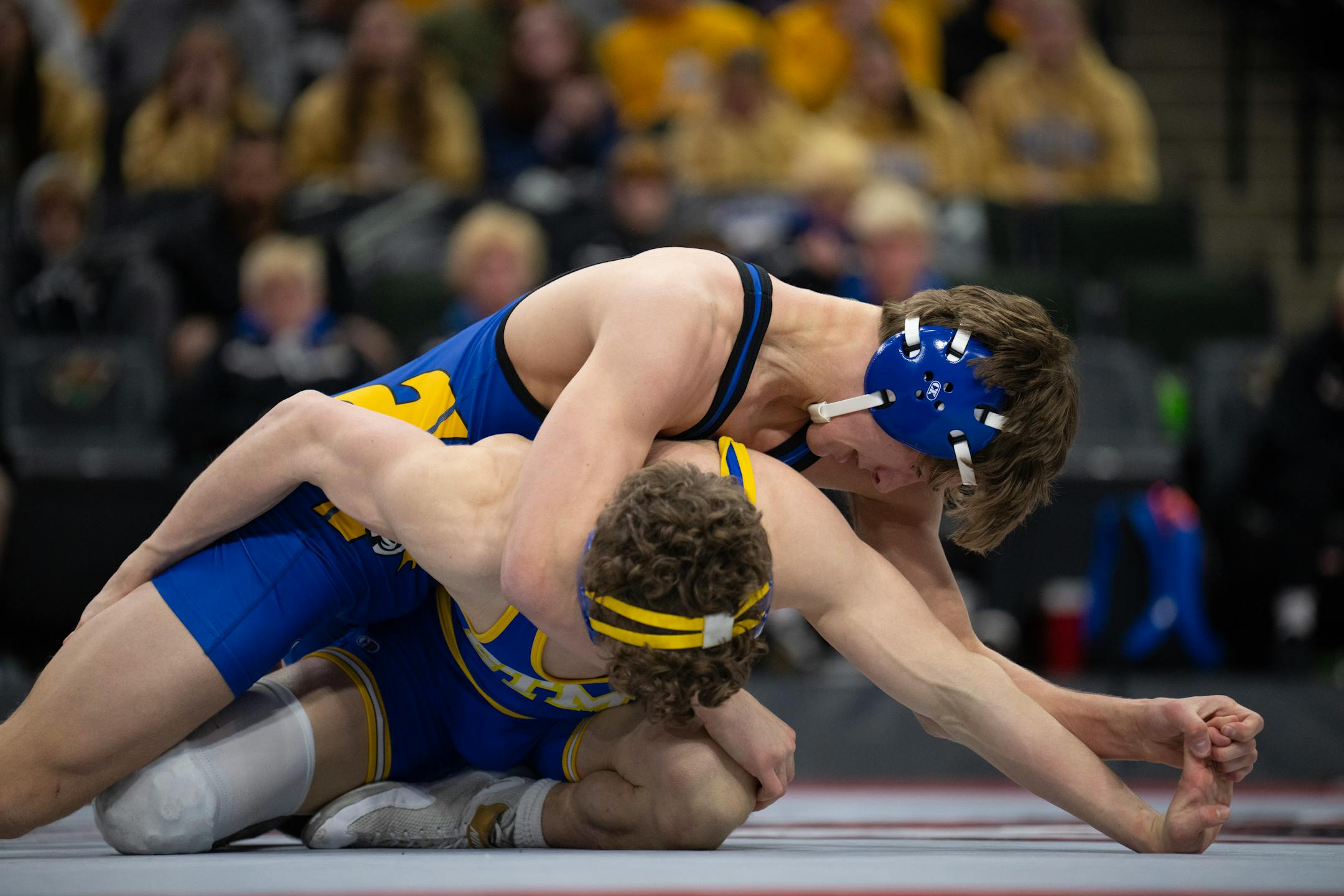 Josh Route of Hastings, top, on his way to a 5-3 decision  over Eli Davis of St. Michael-Albertville in their 145 lb. match.