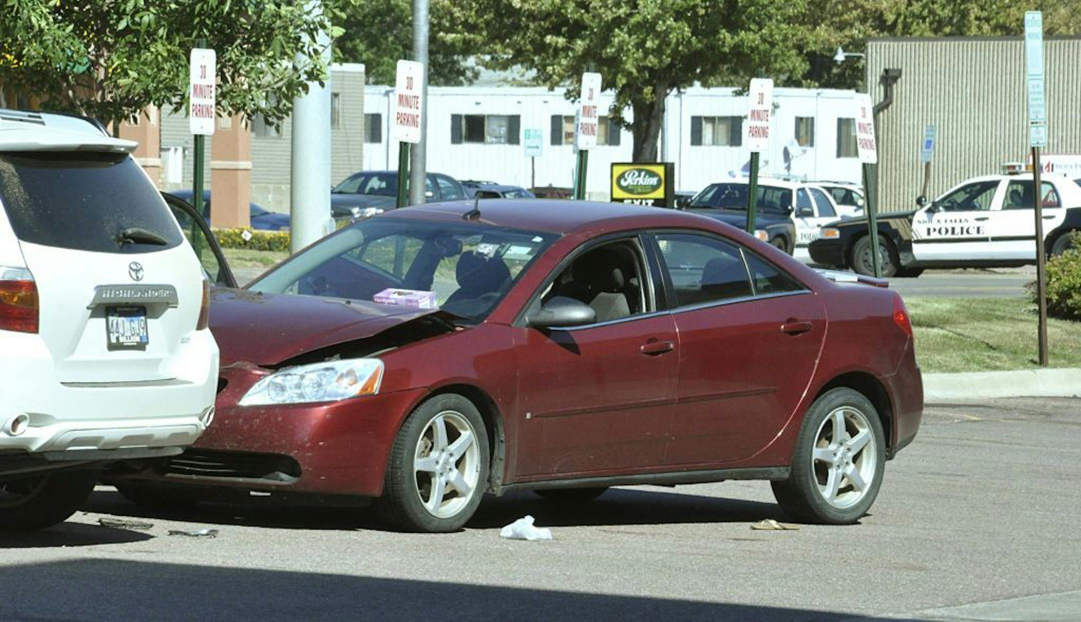 Police in Sioux Falls, S.D., responding to a car accident in the parking lot of the Cost Cutters hair salon found a woman, Amanda Connors, dead inside the car from a gunshot wound, Tuesday, Sept. 11, 2012. Police say the gunman kidnapped his two kids from a babysitter at gunpoint, shot Connors, a Cost Cutters employee, and then holed up inside the salon. Officers later found the man inside dead from an apparent self-inflicted gunshot wound.