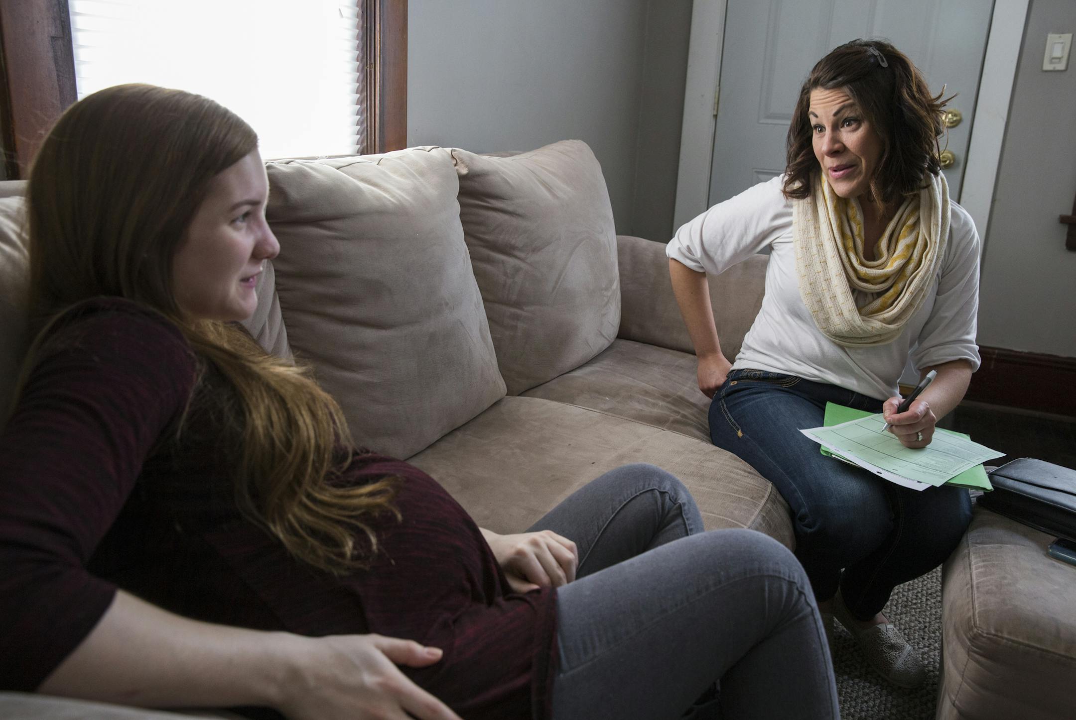 Kristin Lau, a PHN/RN (public health nurse/registered nurse) with Ramsey County visits with expectant mother Annmarie DeRosa, 18, at her home in St. Paul. DeRosa is due on March 25. ] (Leila Navidi/Star Tribune) leila.navidi@startribune.com BACKGROUND INFORMATION: Monday, March 21, 2016.