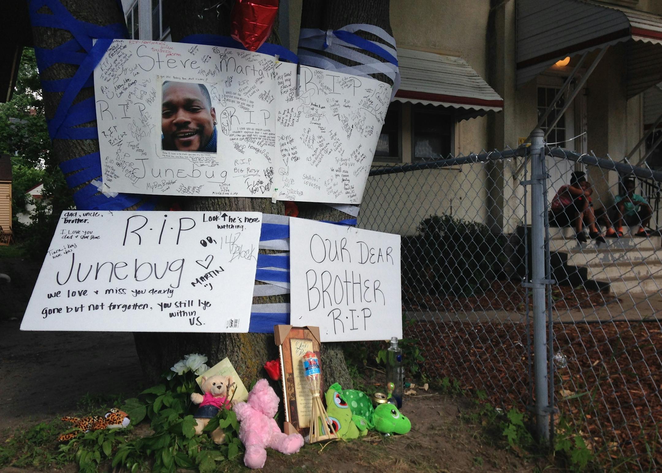 A shrine for Steve Martin was created near the spot where he was shot Monday night, in the 3300 block of Penn Avenue N.
