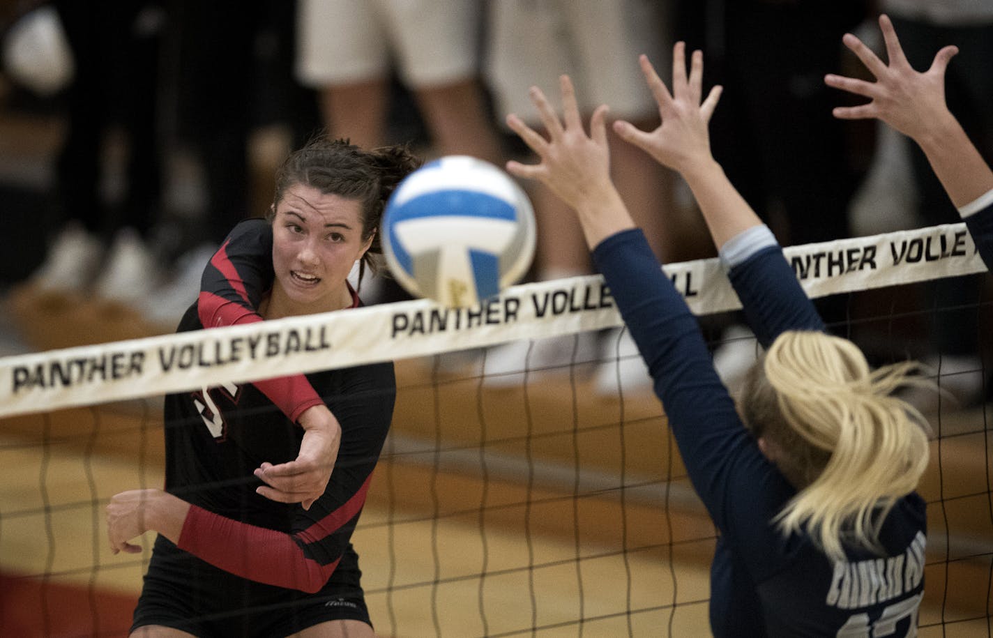 Lakeville North's Elizabeth Juhnke spiked the ball pass Hannah Prasky of Champlin Park in the firs set during volley action at Lakeville North High Tuesday September18, 2018 in Lakeville , MN. ] JERRY HOLT &#xef; jerry.holt@startribune.com