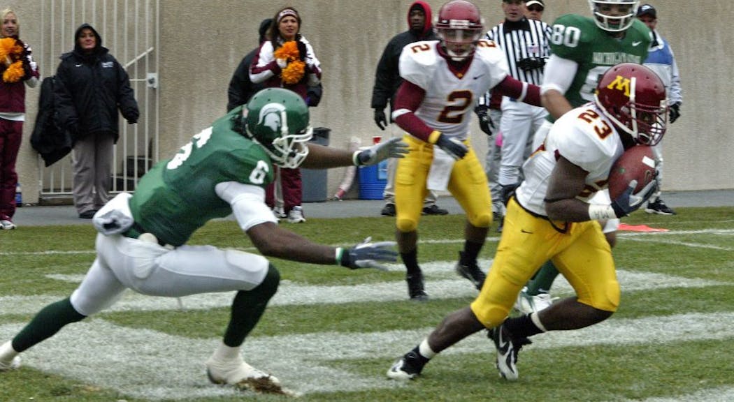 Gophers defender Dominique Barber intercepts a pass against Michigan State in 2006.