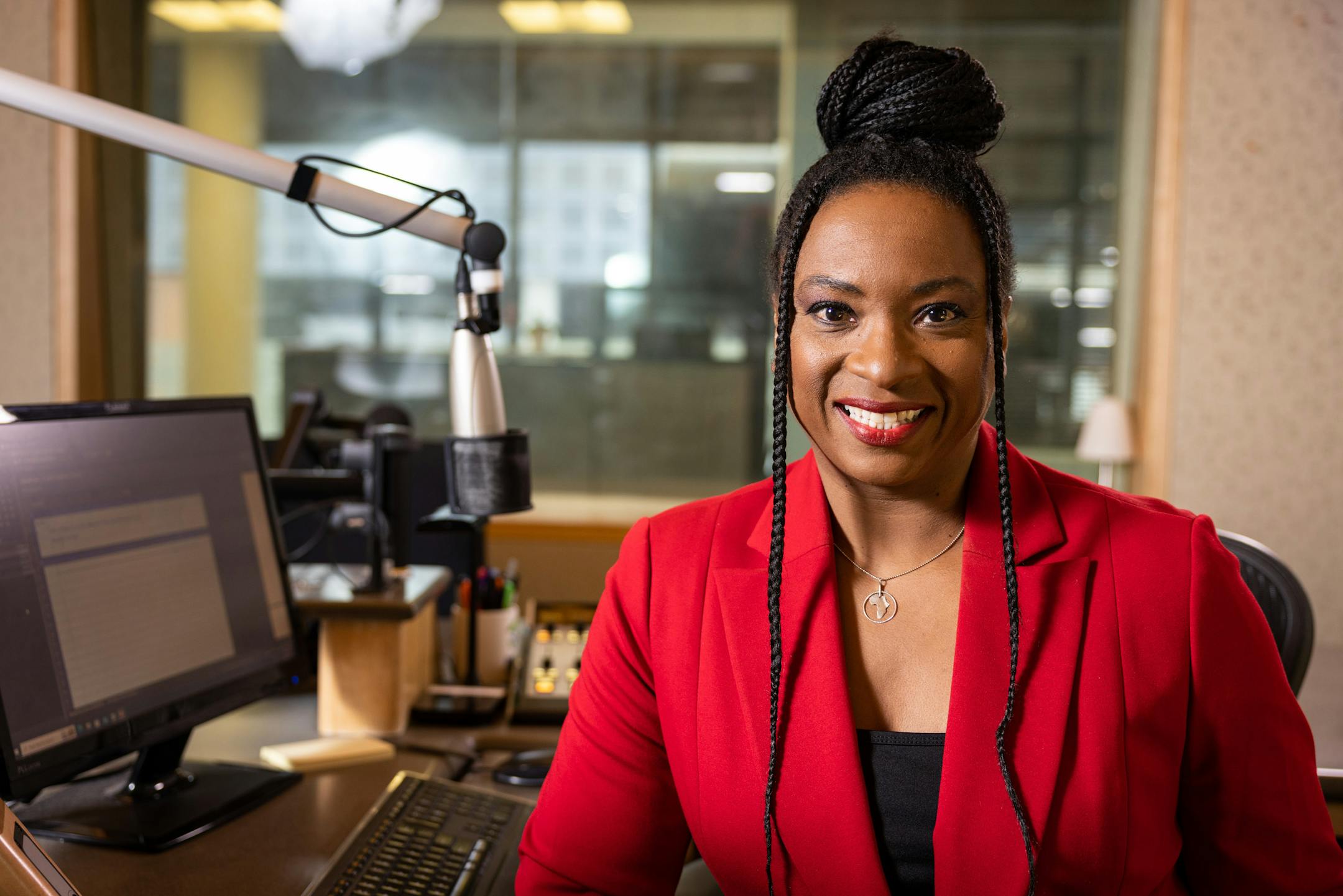 MPR News host Angela Davis poses for a photo inside the Kling Public Media Center in St. Paul on Wednesday, March 1, 2023.