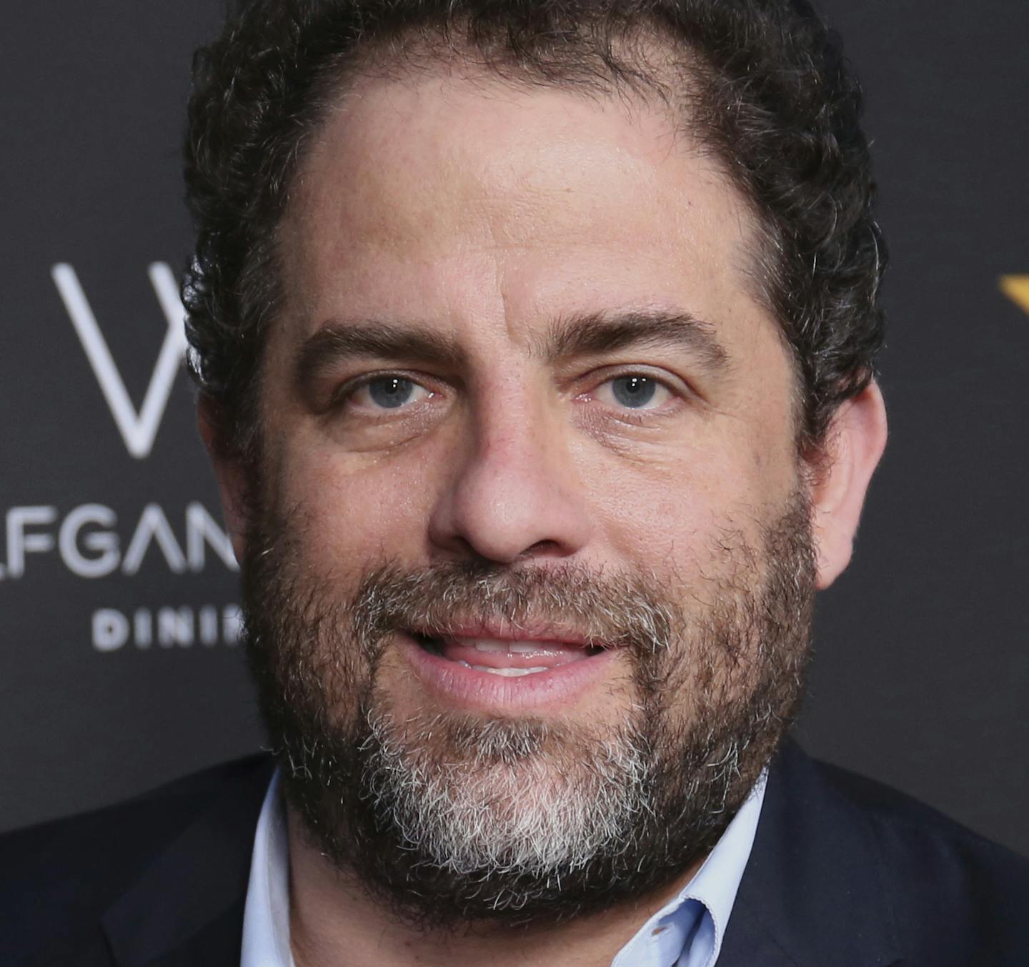 FILE - In this April 26, 2017 file photo, Brett Ratner arrives at the Wolfgang Puck's Post-Hollywood Walk of Fame Star Ceremony Celebration in Beverly Hills, Calif. Ratner was accused by at least six women of sexual harassment. Playboy shelved projects with Ratner and Ratner stepped away from Warner Bros. related activities. He denies the allegations. (Photo by Willy Sanjuan/Invision/AP, File)