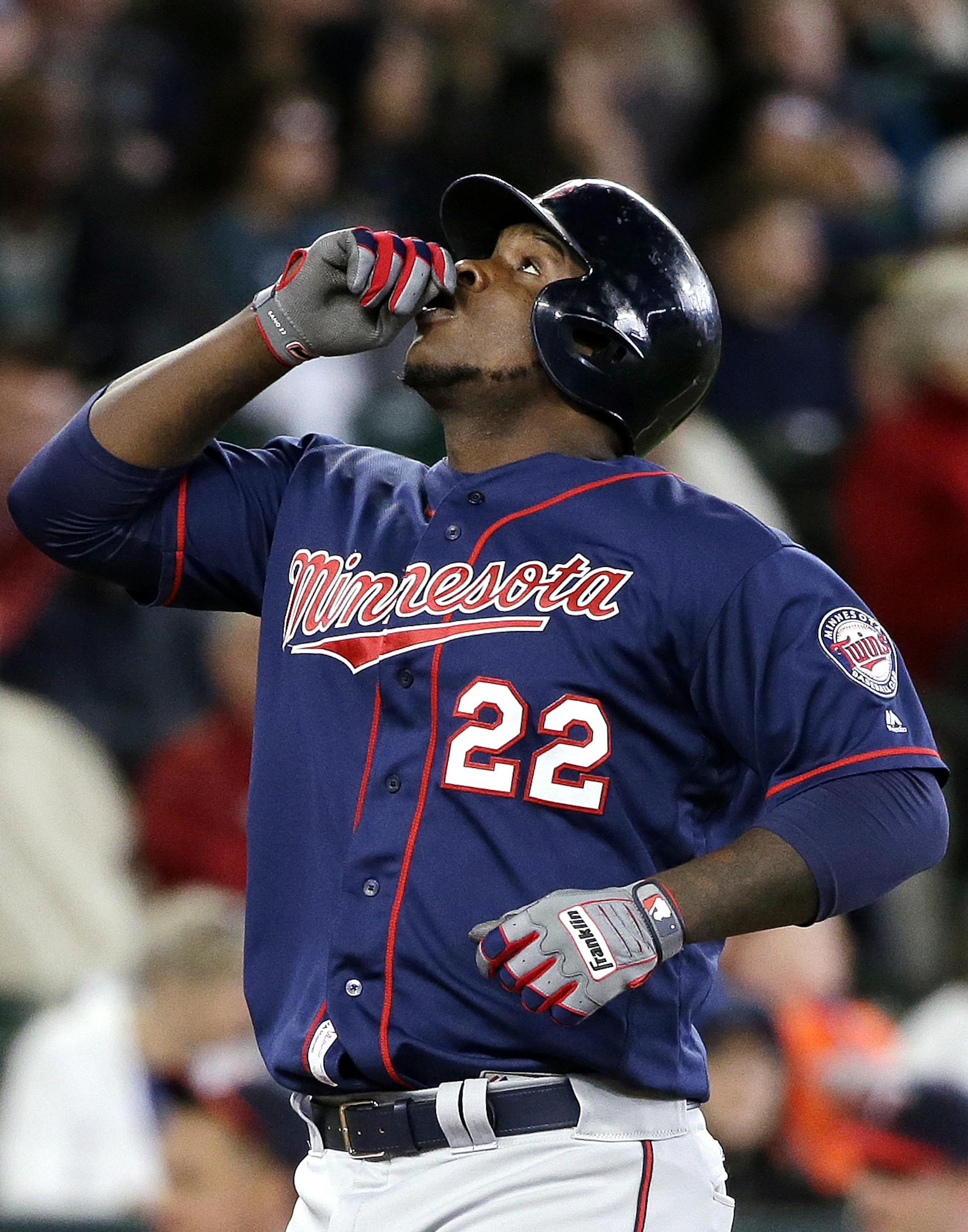 Minnesota Twins' Miguel Sano gestures before pointing skyward as he crosses home on his home run against the Seattle Mariners in the fourth inning of a baseball game Sunday, May 29, 2016, in Seattle. (AP Photo/Elaine Thompson)