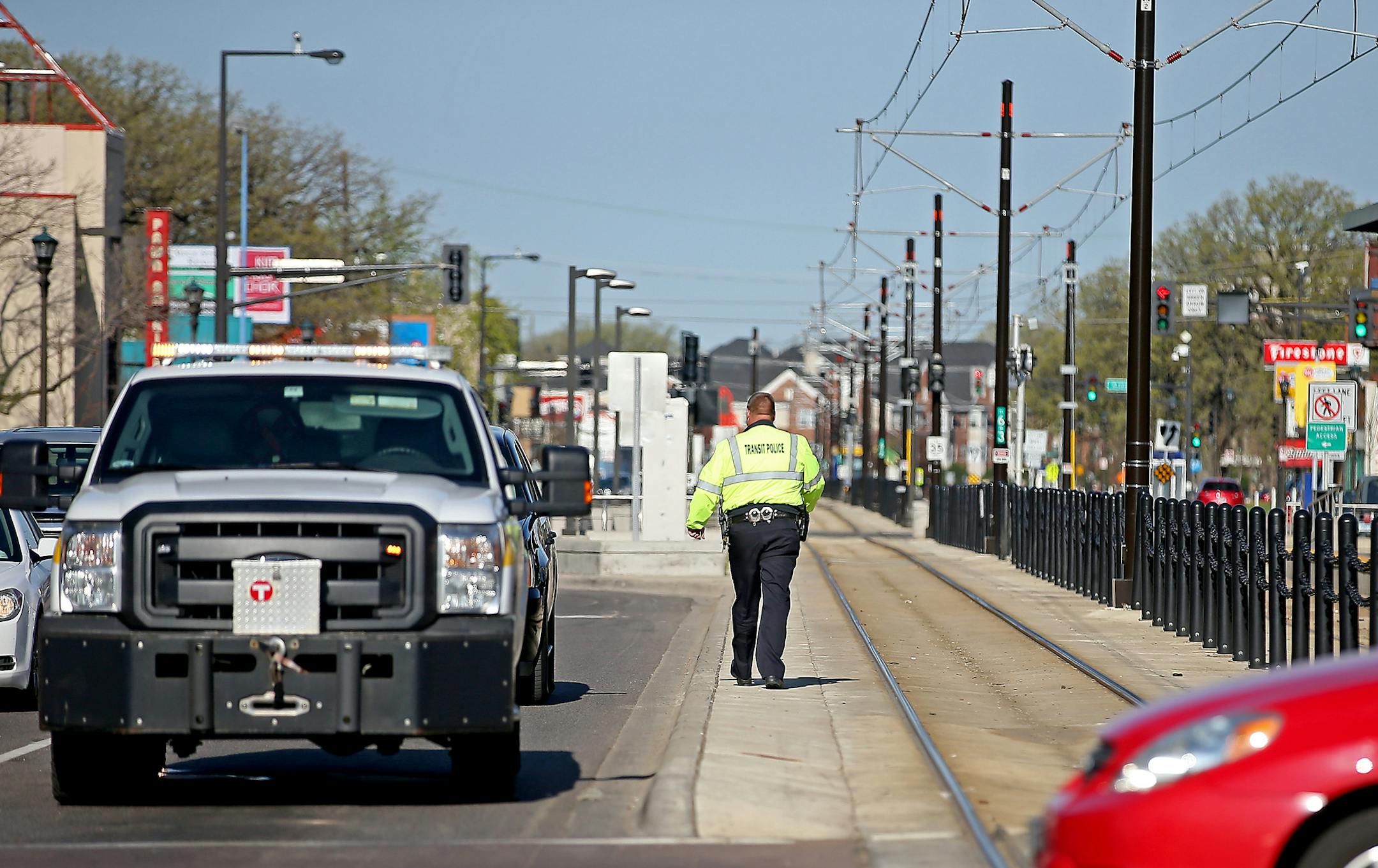 Metro Transit police cleared the scene where a pedestrian was hit at the corner of Snelling and University, Thursday, April 30, 2015 in St. Paul, MN. ] (ELIZABETH FLORES/STAR TRIBUNE) ELIZABETH FLORES • eflores@startribune.com