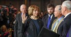 Senator Tina Smith is sworn in by Vice President Mike Pence in a ceremonial swearing in ceremony Wdnesday, Jan. 3, 2018 in Washington,D.C. On the left