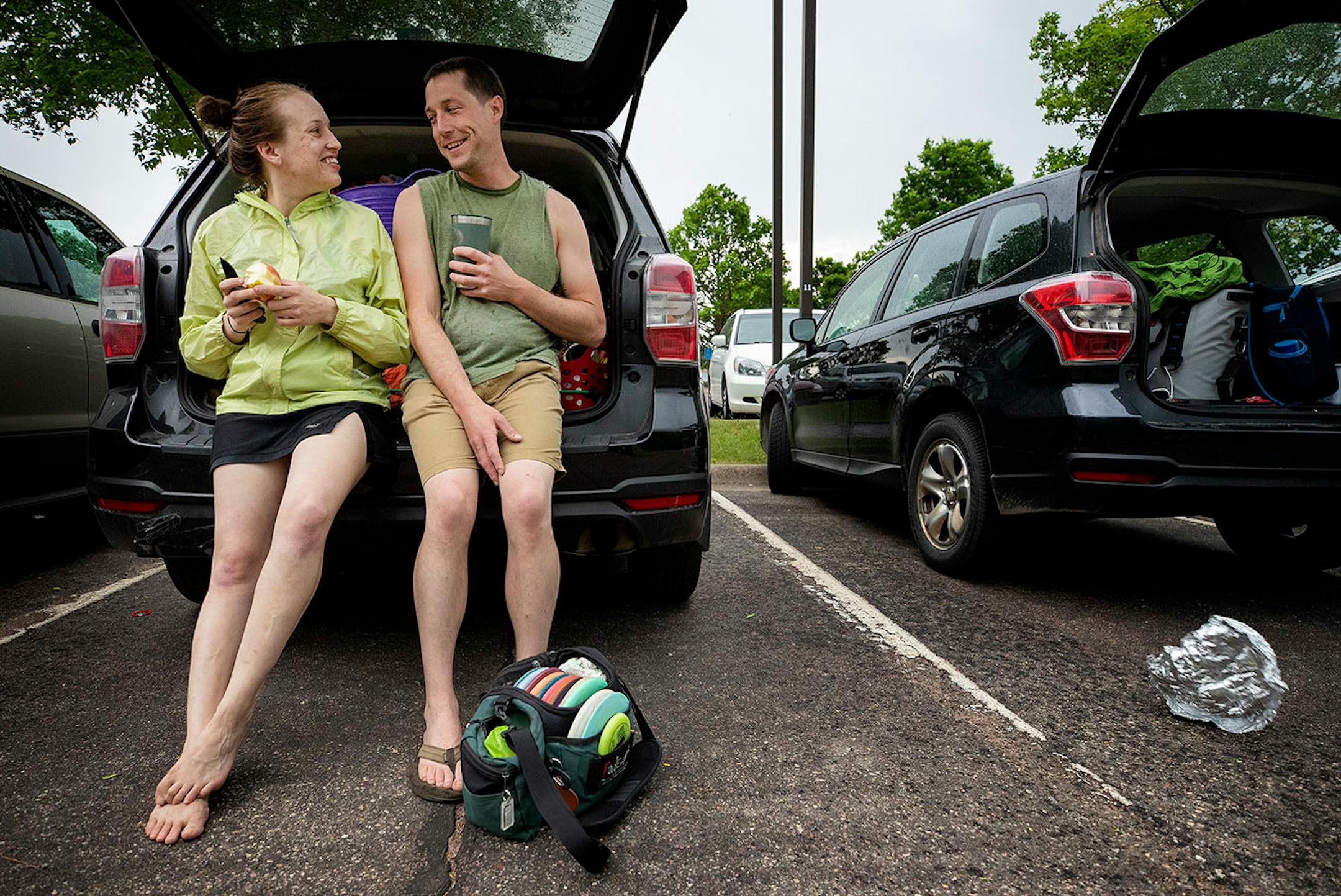 Laurel Anderson, 29, and Brandon Swanson, 34, both of Minneapolis waited out the rain after swimming and planning on playing Disc golf at Bryant Lake Regional Park in Eden Prairie.