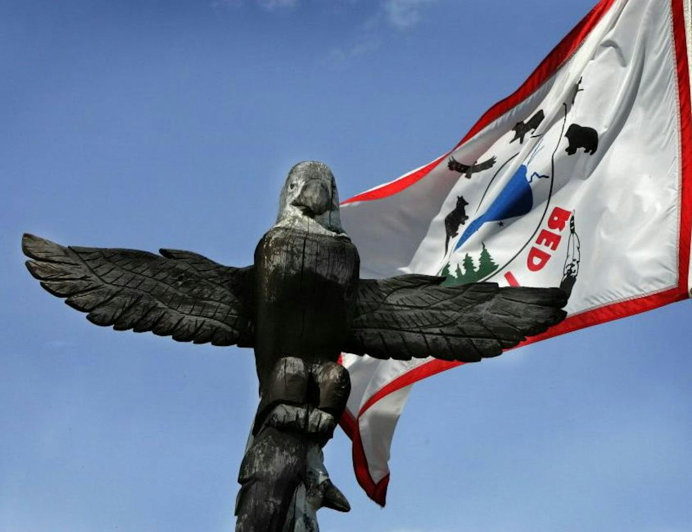 An eagle carving sits atop a totem pole at the Red Lake Nation, which is debating whether to get into the medical marijuana business.