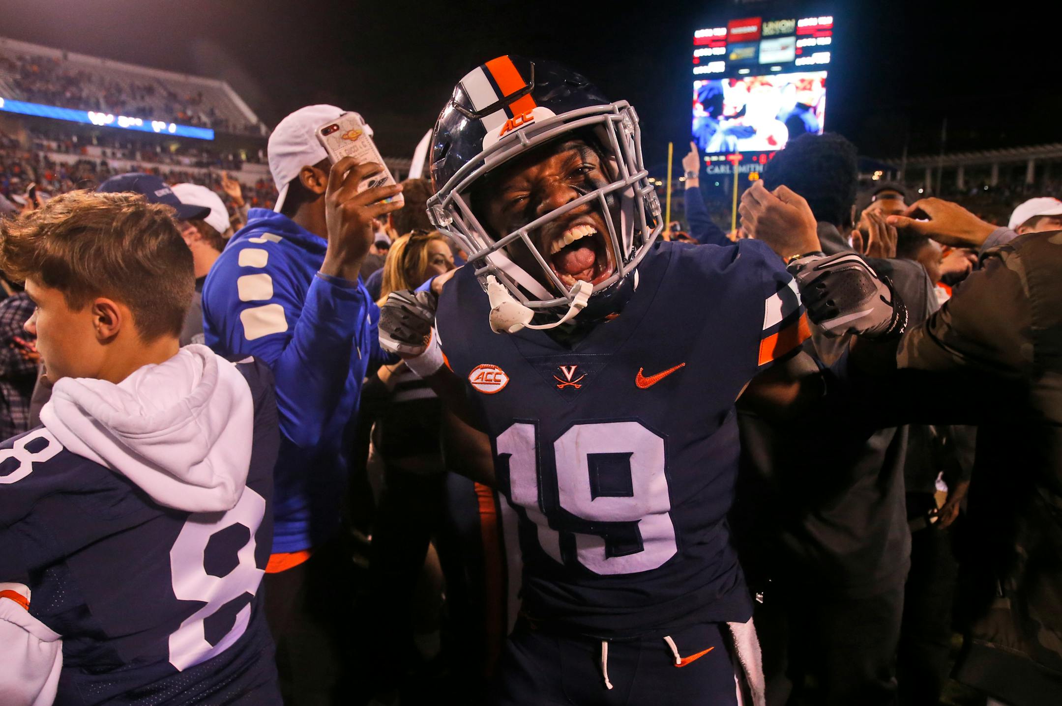 Virginia wide receiver Chuck Davis (19) celebrates his team's win over Miami after an NCAA college football game in Charlottesville, Va., Saturday, Oct. 13, 2018. Virginia defeated Miami 16-13. (AP Photo/Steve Helber)
