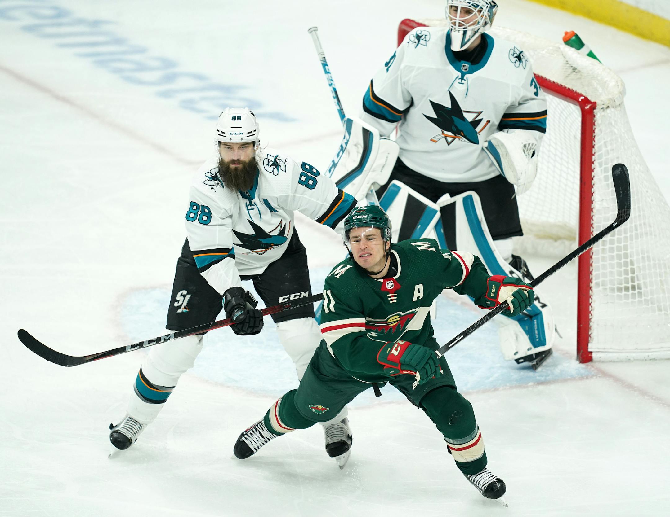 Wild left wing Zach Parise got a hard hit from San Jose Sharks defenseman Brent Burns in front of the San Jose net in the second period.