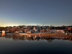 A portion of Stillwater is reflected in the St. Croix River, seen from the Lift Bridge.