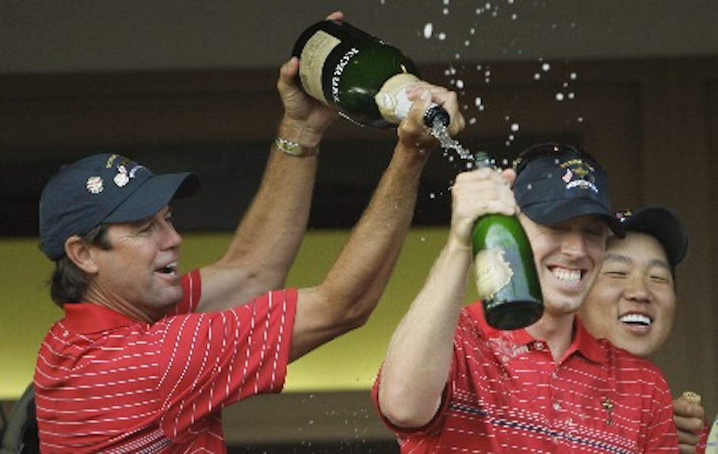 United States team captain Paul Azinger, left, poured champagne on Hunter Mahan after winning the Ryder Cup golf tournament at the Valhalla Golf Club in Louisville, Ky., in 2008.