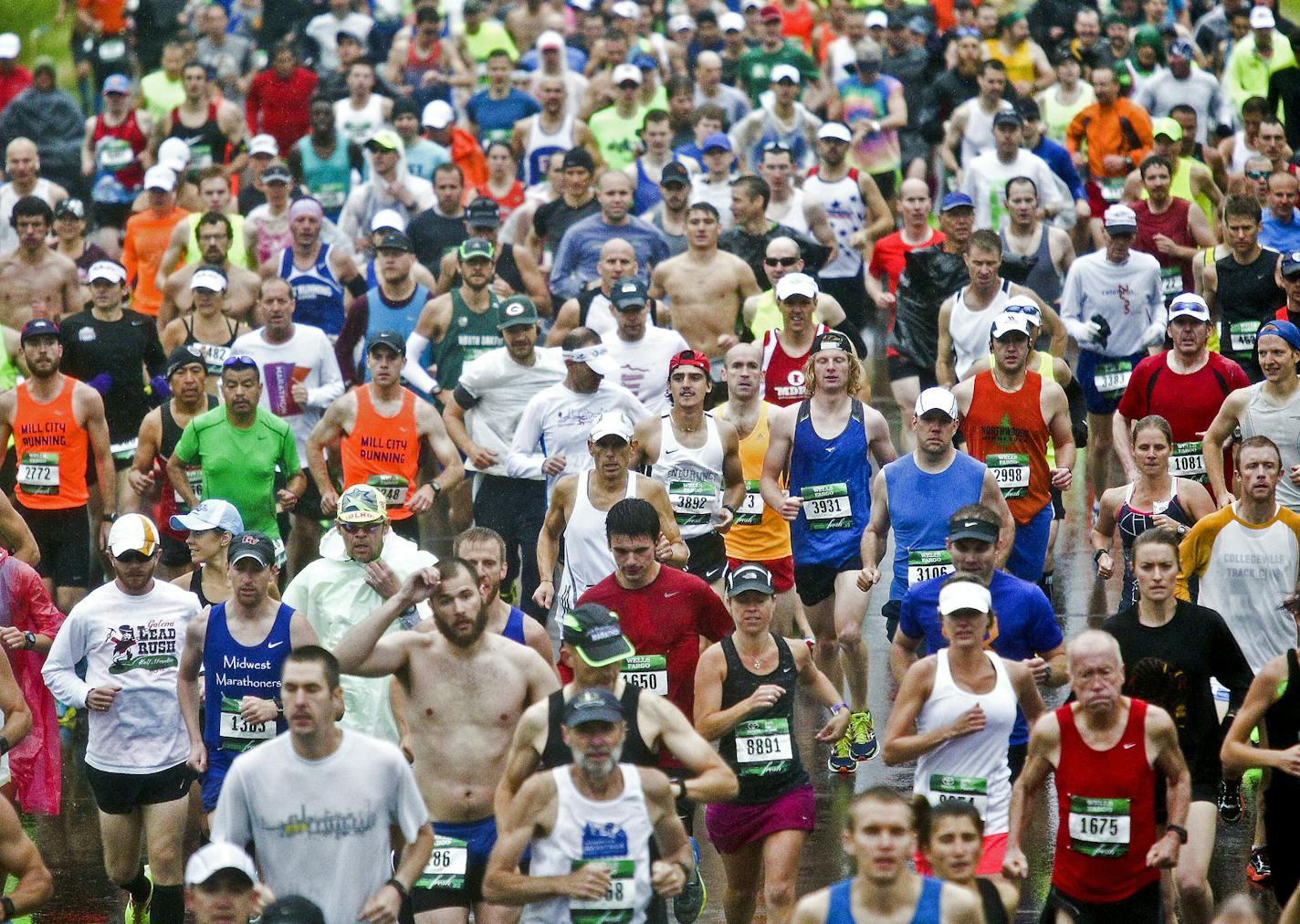 t062015 --- Clint Austin --- austinGMAS0621c36 --- Runners fill Scenic Highway 61 at the starting line area of Grandma's Marathon near Two Harbors, Minn. Saturday morning. Participants dealt with heavy rain at the start of the race. (Clint Austin / caustin@duluthnews.com) ORG XMIT: MNDUH1