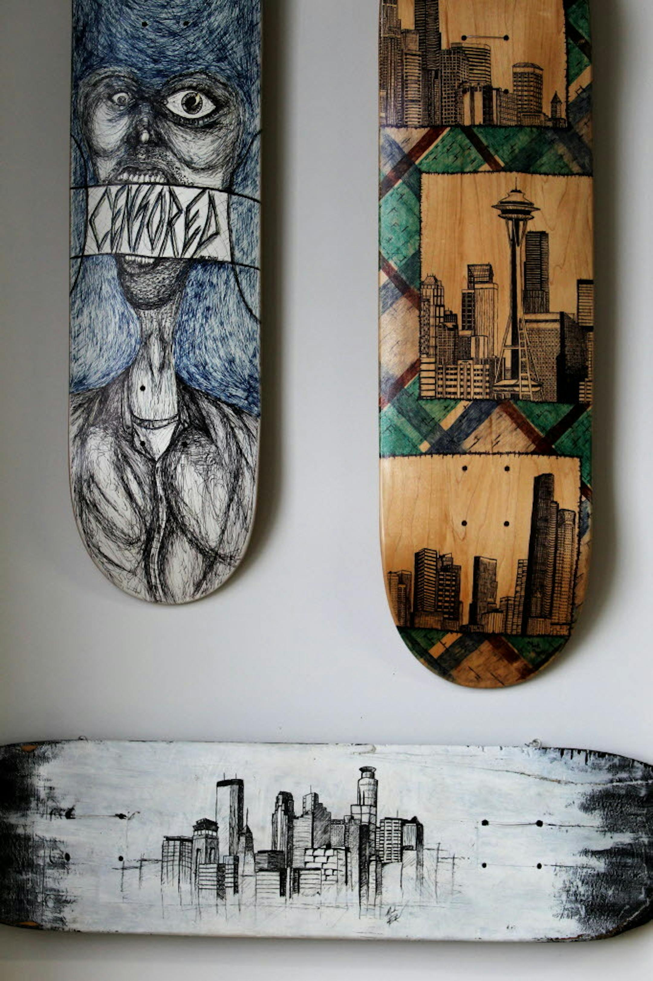 Mark Rivard started out using sharpies to draw on skateboards. The bottom skateboard is his first from 2004.