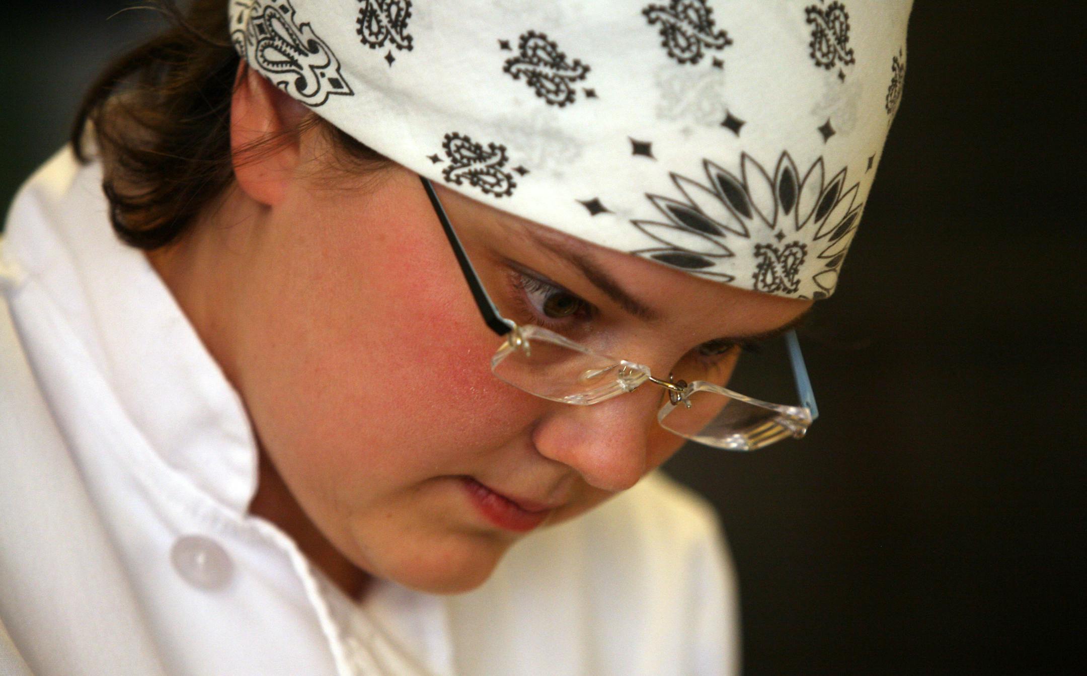 Baker Solveig Tofte, of the Turtle Bread Co., concentrated as she made slits in her baguette dough during her baking practice. Tofte along with two other teammates will represent the US in Paris in a world baking competition.