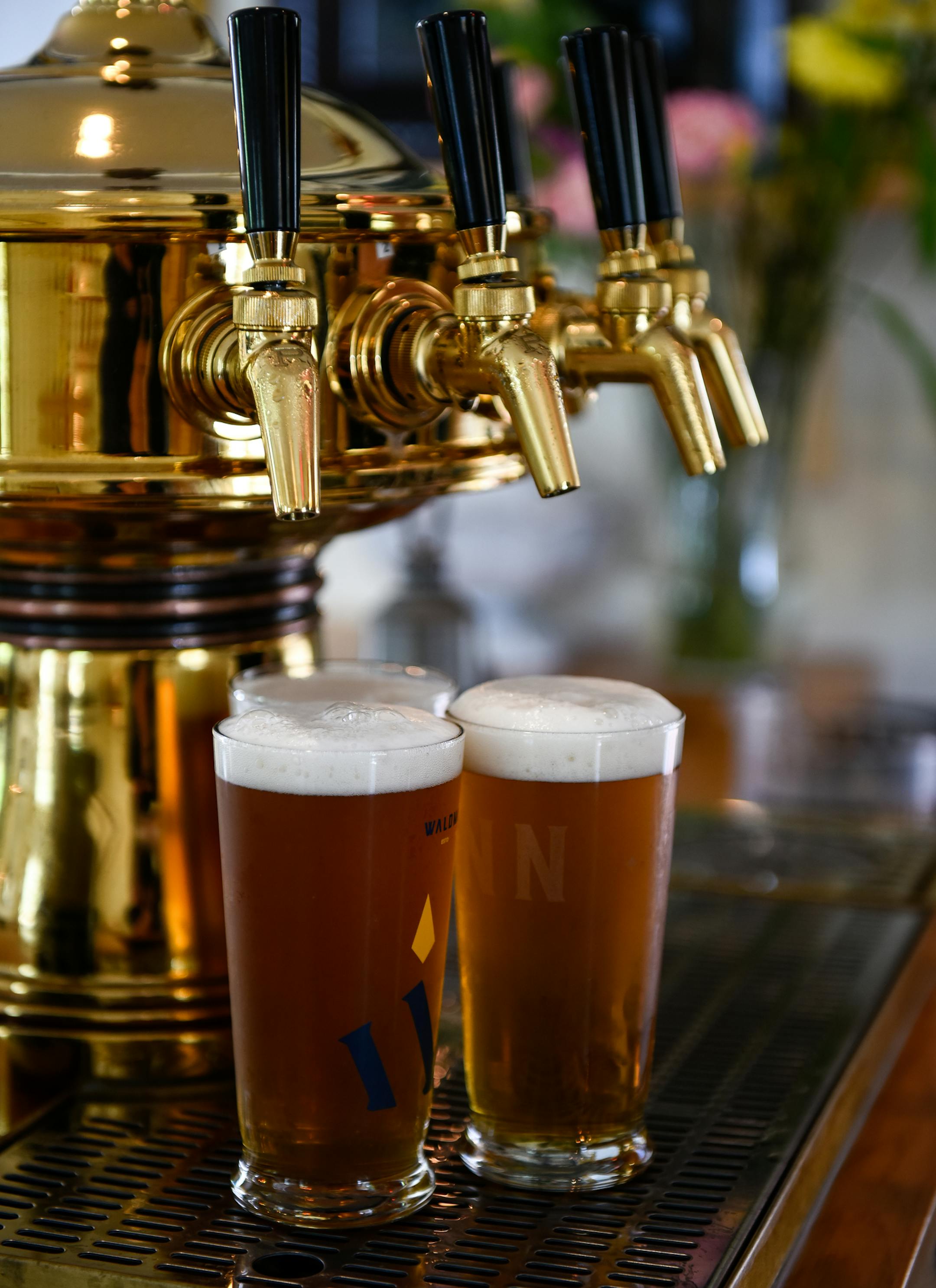 Waldmann Brewery server Kadyn Hutchinson poured a few pilseners for customers while working Friday afternoon. ] AARON LAVINSKY ï aaron.lavinsky@startribune.com Cover story on two bike-and-beer routes through Twin Cities taprooms. We photograph Waldmann Brewery and Wurstery on Friday, June 1, 2018 in St. Paul.