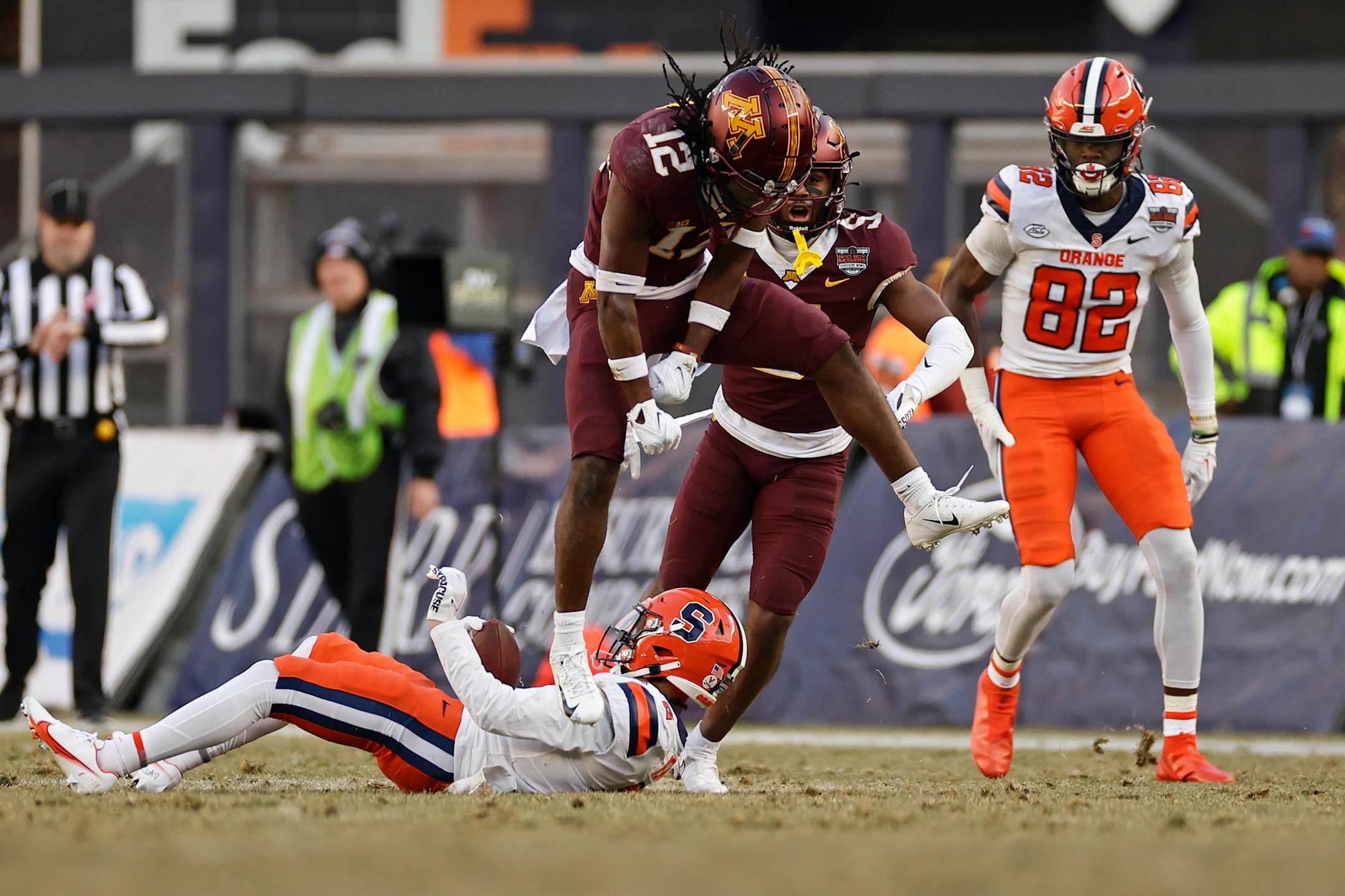 Minnesota defensive back Darius Green (12) reacts after tackling Syracuse wide receiver Trebor Pena during the first half.