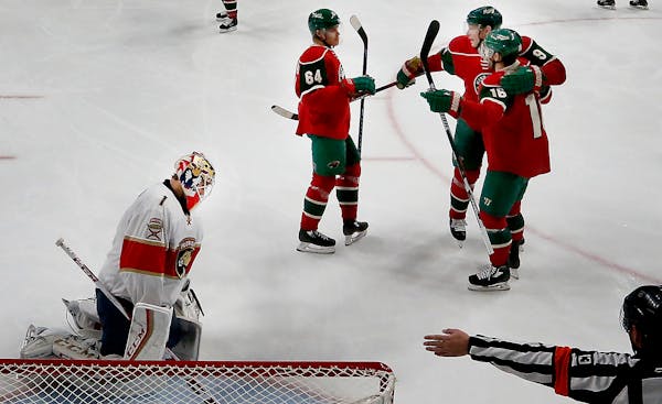 Mikko Koivu (9) celebrated with Jason Zucker (16) and Mikael Granlund (64) after scoring a goal against the Florida Panthers in December. ] CARLOS GON