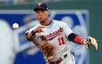 Minnesota Twins shortstop Jorge Polanco throws to first on a grounder by Kansas City Royals' Humberto Arteaga during the first inning of a baseball ga