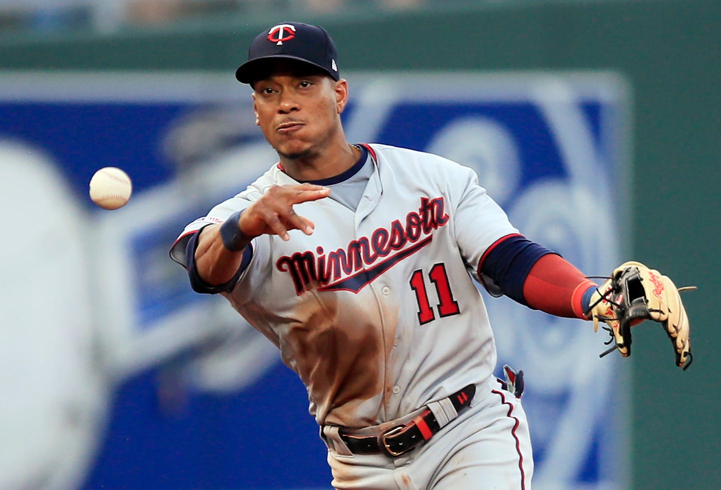 Minnesota Twins shortstop Jorge Polanco throws to first on a grounder by Kansas City Royals' Humberto Arteaga during the first inning of a baseball game at Kauffman Stadium in Kansas City, Mo., Friday, June 21, 2019. Arteaga was safe on a throwing error by Polanco and a run scored on the play. (AP Photo/Orlin Wagner)