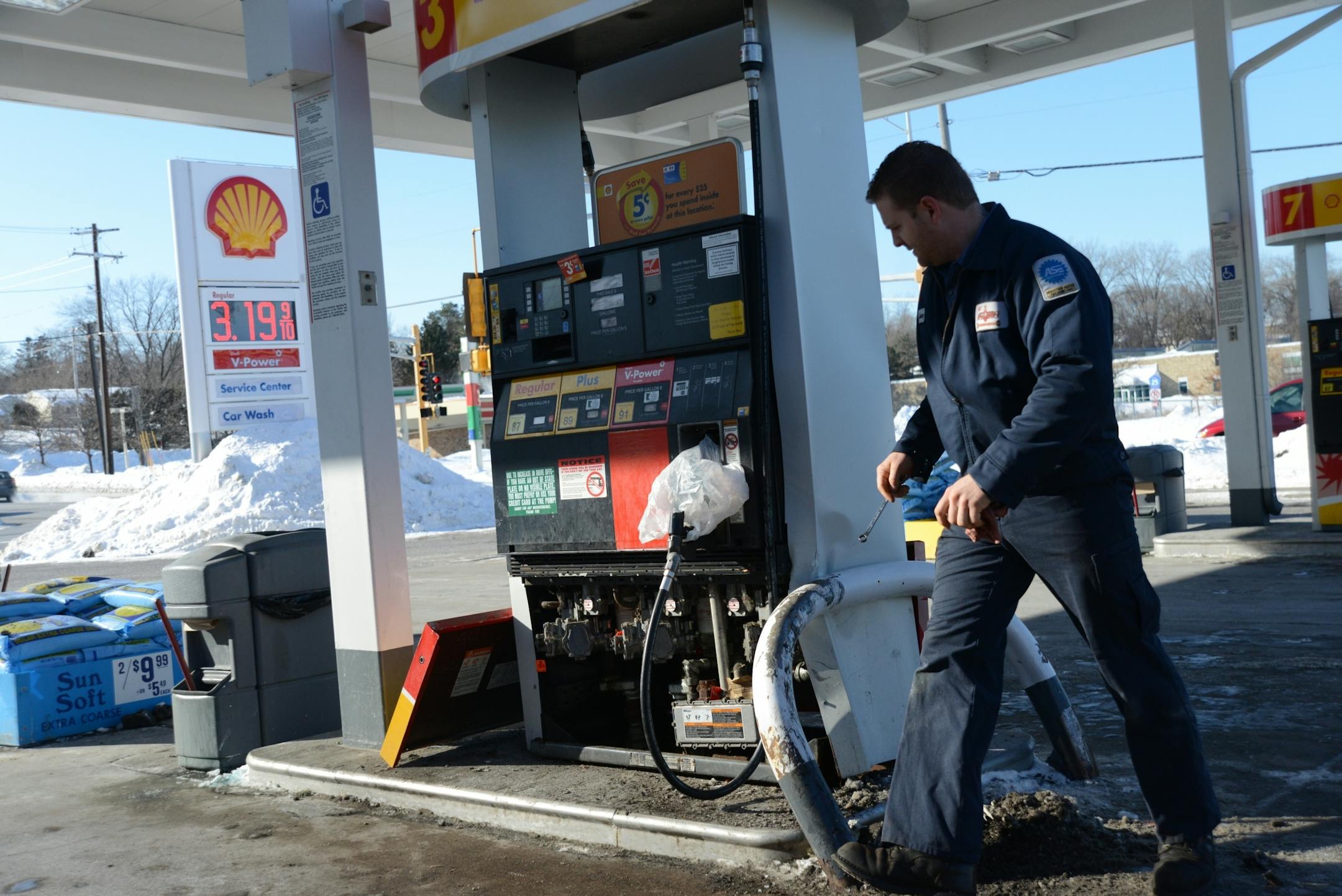 A stolen school bus crashed into a gas pump at shell station at the intersection of County Road B and Dale Street in Roseville on Monday. Jeremy Badger, who works in a repair garage next to the gas station, looked over the gas pump that the bus struck.