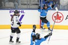 Toronto's Emma Maltais, at top middle, celebrates after scoring against Minnesota during the second period of Game 1 of a PWHL playoffs series Wednesd