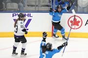 Toronto's Emma Maltais, at top middle, celebrates after scoring against Minnesota during the second period of Game 1 of a PWHL playoffs series Wednesd