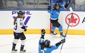 Toronto's Emma Maltais, at top middle, celebrates after scoring against Minnesota during the second period of Game 1 of a PWHL playoffs series Wednesd