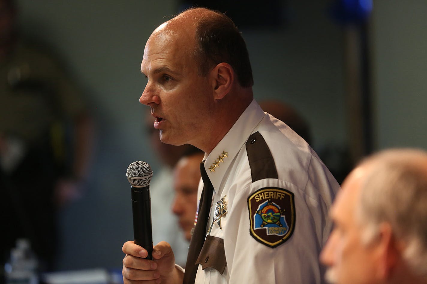 Hennepin County Sheriff Rich Stanek moderated a panel of law enforcement and community members as they began discussing the problem of heroin in all communities.